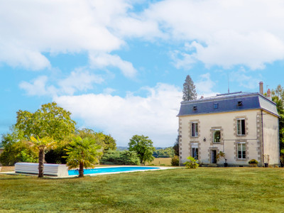 Stunning 8-bedroom mansion nestled in scenic parkland with heated pool, just 10 mins from Limoges.
