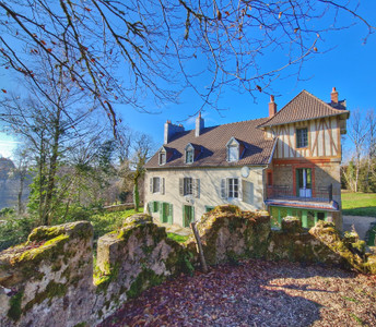 Imposing country manor house with second house to renovate in a serene woodland setting near Felletin