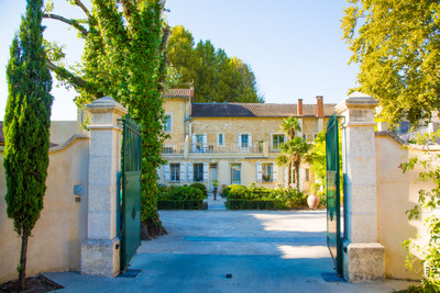 In Provencal Orange, center of town, monumental property, with 2 pools, tennis court and beautiful garden.