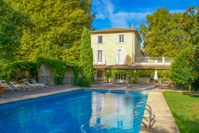 In Provencal Orange, center of town, monumental property, with 2 pools, tennis court and beautiful garden.