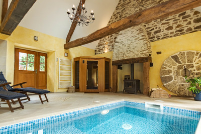 Unique, tasteful home, stone house and buildings set in over 8 acres with river frontage, indoor pool & sauna