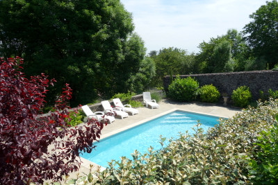 Beautifully renovated 6 bedroom village house with 3-4 bedroom gite. Pool. Terrace view of the countryside
