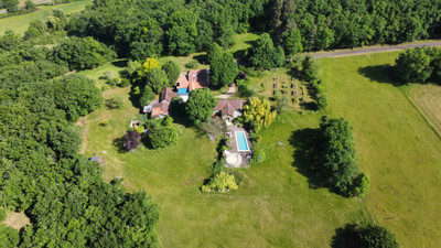 Stone house with a modern extension, 17 hectares of woods and fields, swimming pool and outhouses to renovate