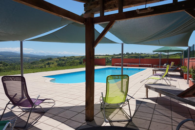 Stunning domain with spectacular views of the mountains, almost 1 hectare de terrain. Principal home with 3 large, beautiful gites and a 50 m2 studio. Private yet close to facilities with fantastic business opportunities. Must be seen to fully appreciate 