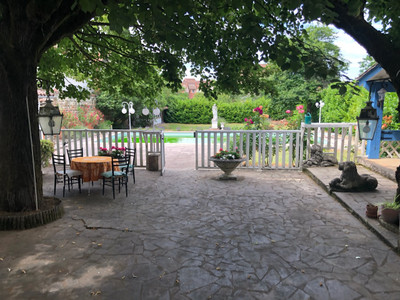 230 m2 house of character in a village with a historic gateway,