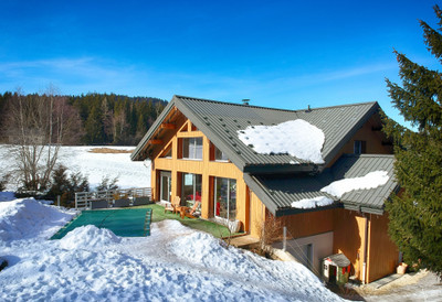 Exclusive architect designed ski chalet for sale in La Feclaz, tranquil, private location, with swimming pool