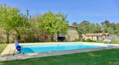 Five-bedroom chateau with two gites in private grounds of over five hectares. Swimming pool, lake, sauna