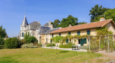 Five-bedroom chateau with two gites in private grounds of over five hectares. Swimming pool, lake, sauna