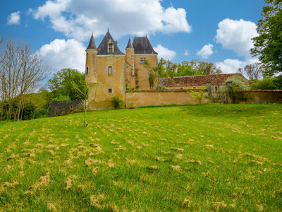 An unspoilt, authentic, medieval to renaissance castle with outbuildings above a river valley within 25 ha.