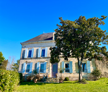 Stunning former Cognac house in 2.5 acres within walking distance to popular village and amenities. Rare find!