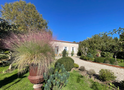 Beautifully renovated stone house in immaculate enclosed garden. Calm and close to amenities.