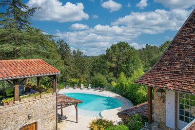 Set of three stone buildings, swimming pool, terraces, meadows and woodland. 