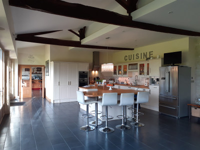 Stunning barn conversion finished to an exceptional standard with potential for gites or B&B. Swimming pool.
