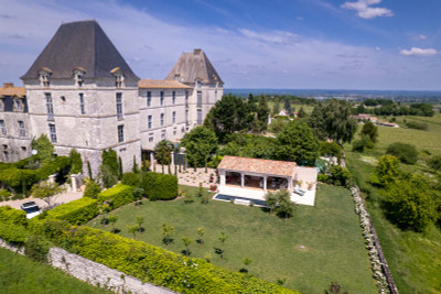 Luxurious and spacious furnished (16th Century) Chateau Wing with landscaped gardens, views and swimming pool.